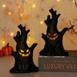 LED electronic candle lights, ghost tree stump decorations, and ghost face ornaments for festive ambiance